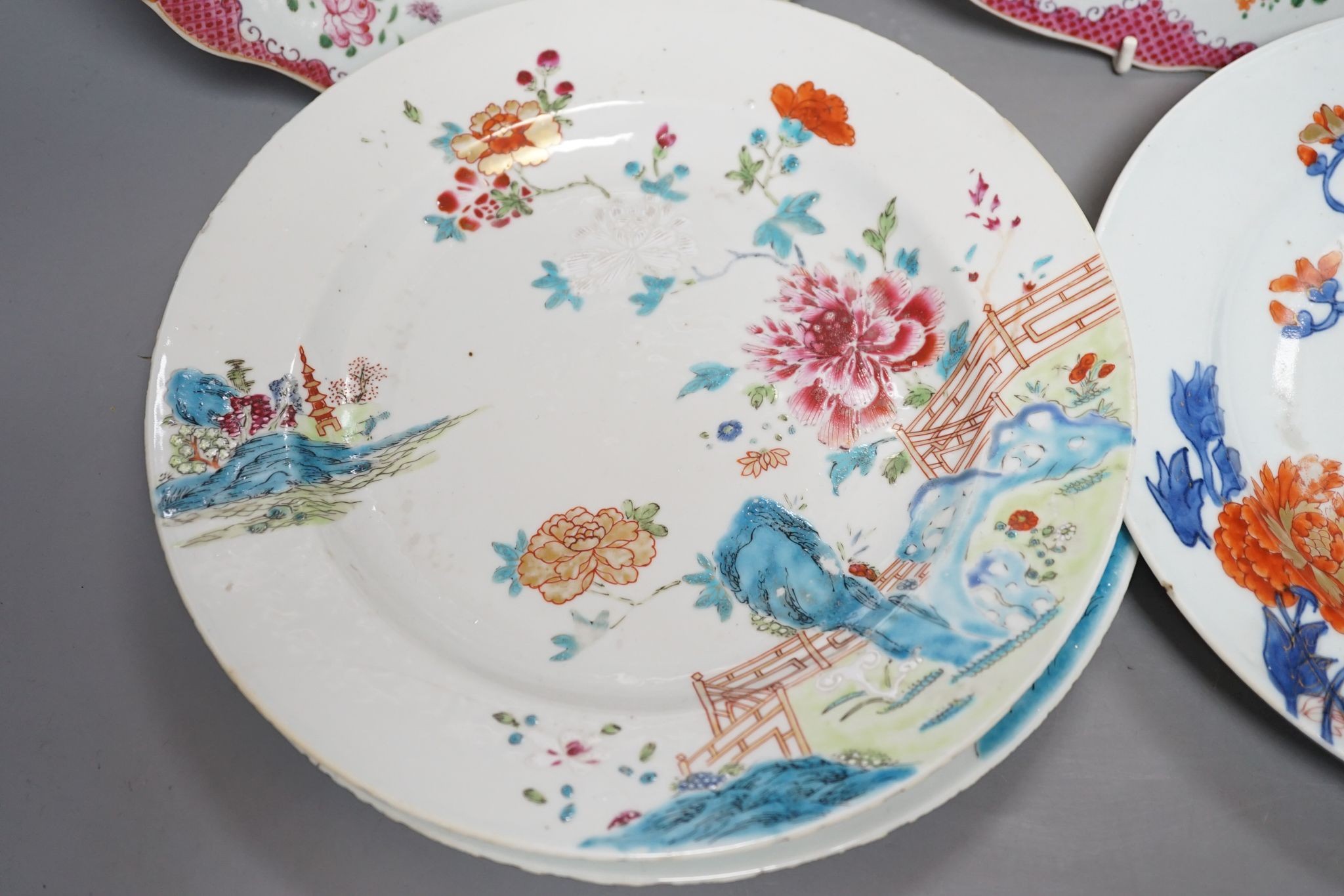 Two pairs of 18th century Chinese famille rose plates and an Imari plate, 26cm